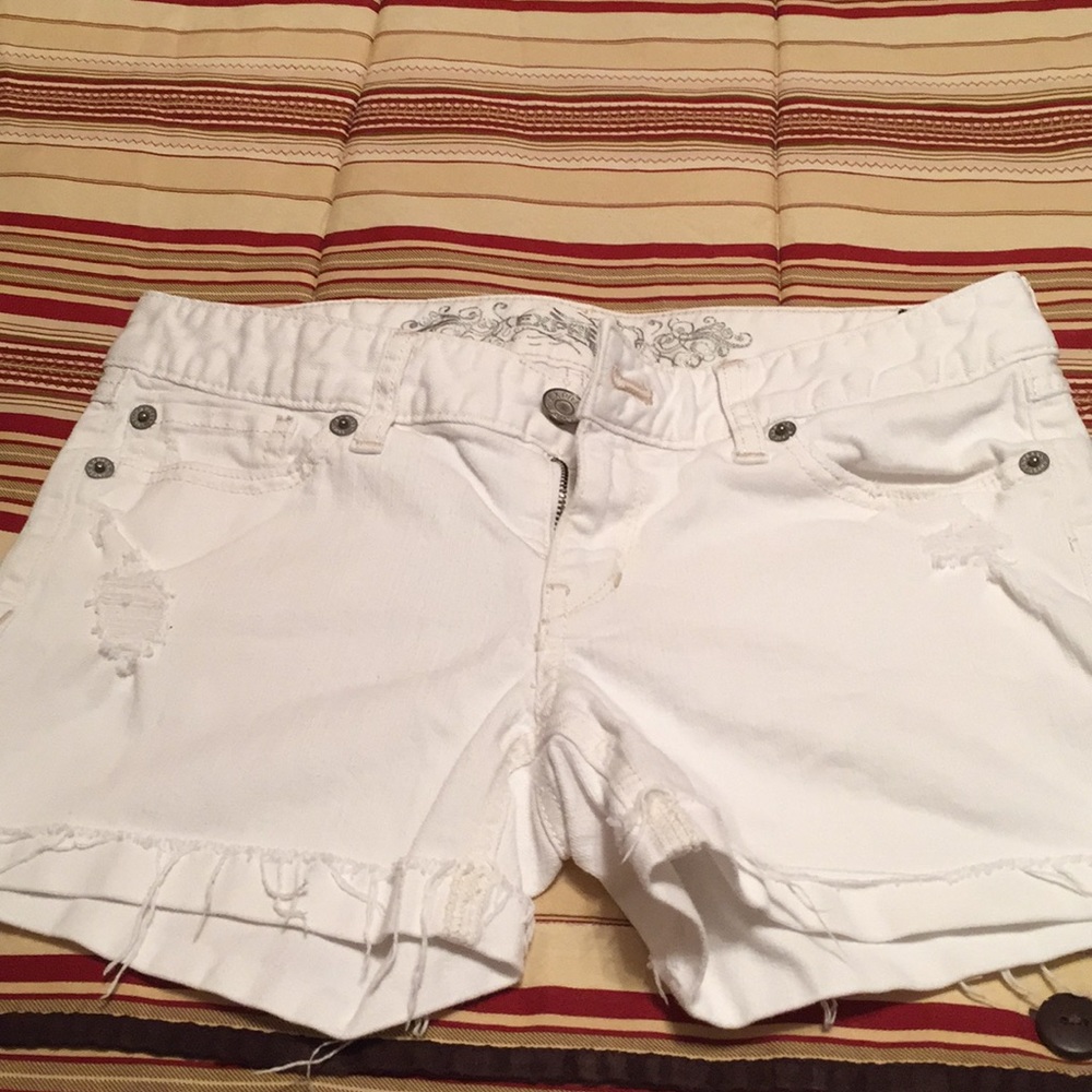 White distressed shorts